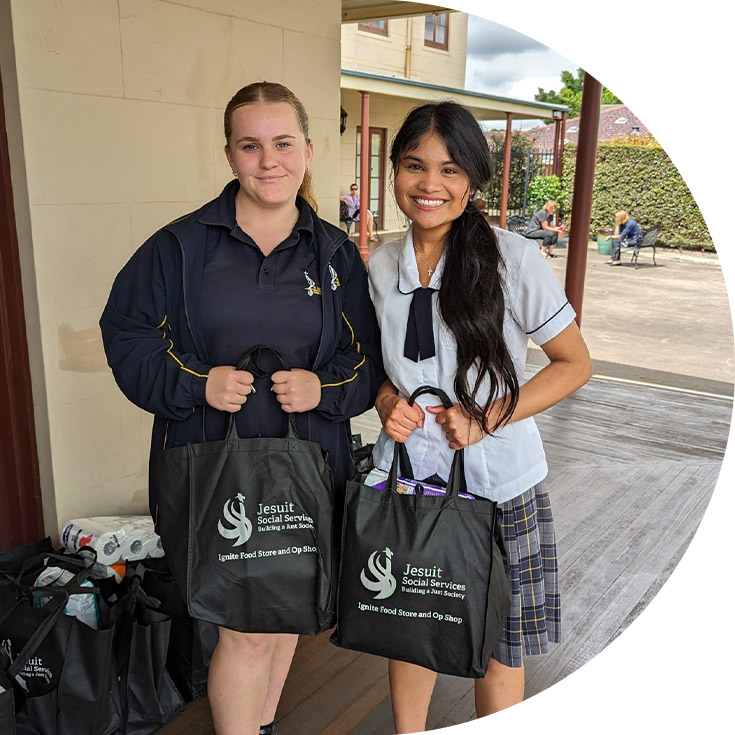 Students holding donated items at St Agnes Catholic High School Rooty Hill